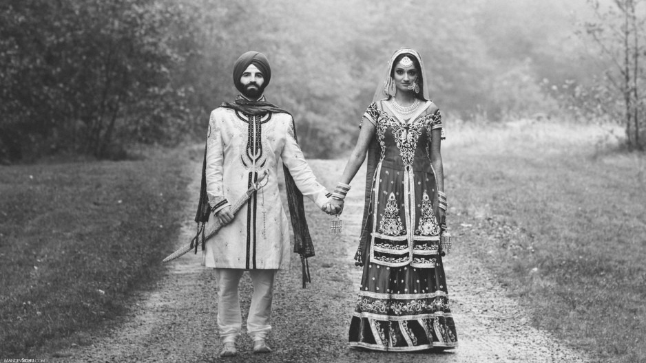 Sikh Marriages and Caste sikh couple holding hands in wedding attire