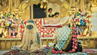 Sikh Couple sitting at a Gurdwara